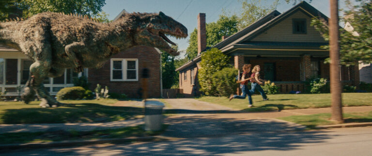Dinosaurs and Doubt in Suburbia: Mitchell’s New Trailer Hints at a Deeper Mystery
